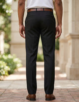 Back view of male model wearing black tailored dress pants with a white long-sleeve shirt.
