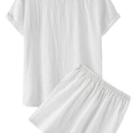 Back view of white textured short-sleeve shirt with matching drawstring summer shorts on a white background.