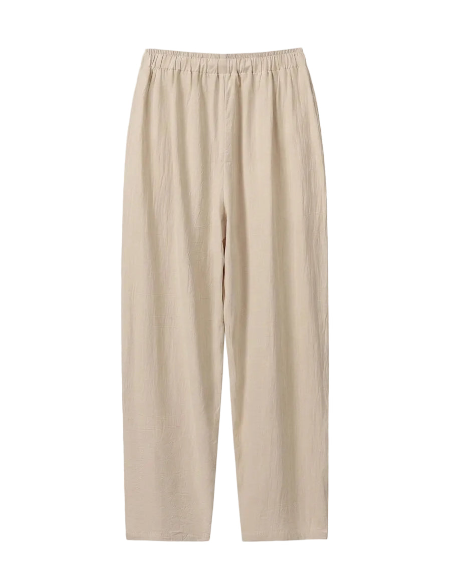 Beige pants on a light gray background