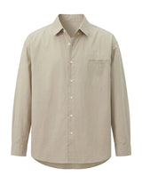 Beige button-up shirt on a light gray background