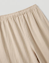 Beige pants on a light gray background