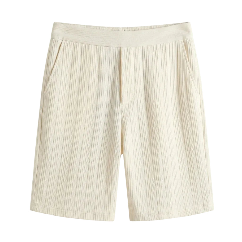 Beige pleated shorts on a light gray background