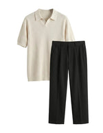 Beige polo shirt and black pants on a light gray background