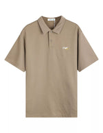 Beige polo shirt with a small logo on a white background