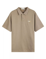 Beige polo shirt with a small logo on a white background