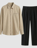 Beige shirt and black pants on a light gray background
