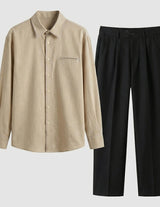 Beige shirt and black pants on a light gray background