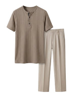 Beige shirt and pants set on a light gray background