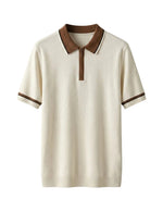Beige short-sleeve knit shirt with brown collar on a light gray background