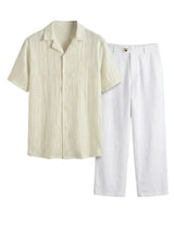 Beige short-sleeve shirt and white pants on a white background