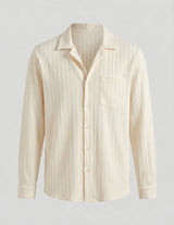 Beige striped shirt on a light gray background