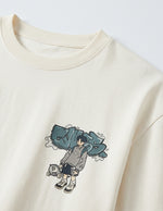 Beige sweatshirt with a graphic design of a person holding a bag on a white background