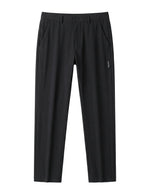 Black casual pants with tapered straight legs on a white background.