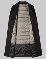 Black coat with beige lining on a white background