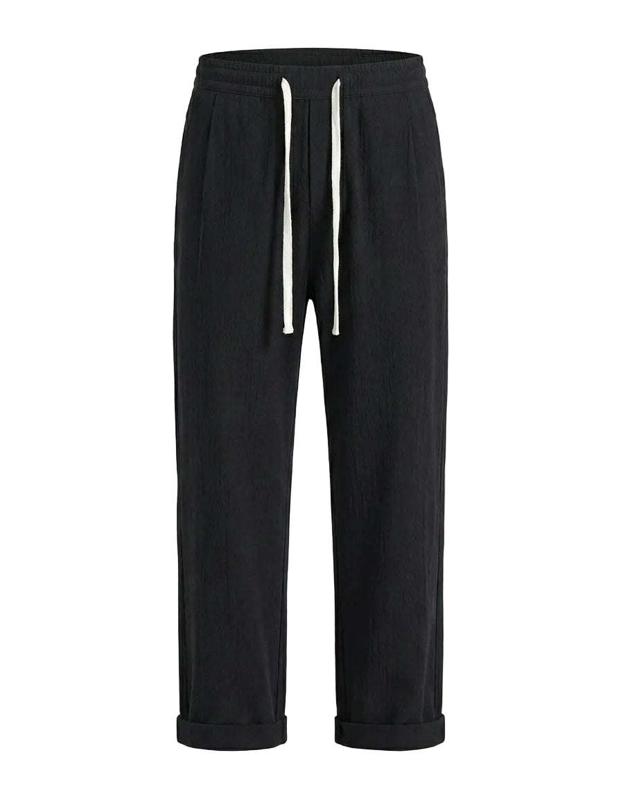 Black drawstring jogger pants with tapered legs on a white background.