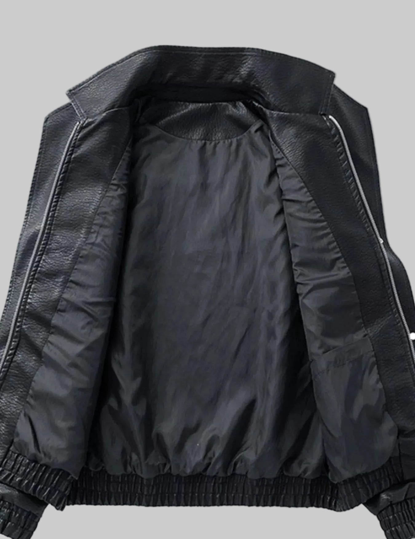 Black leather jacket with a black satin lining, featuring a wide collar, zippered front, and elasticized cuffs and hem.