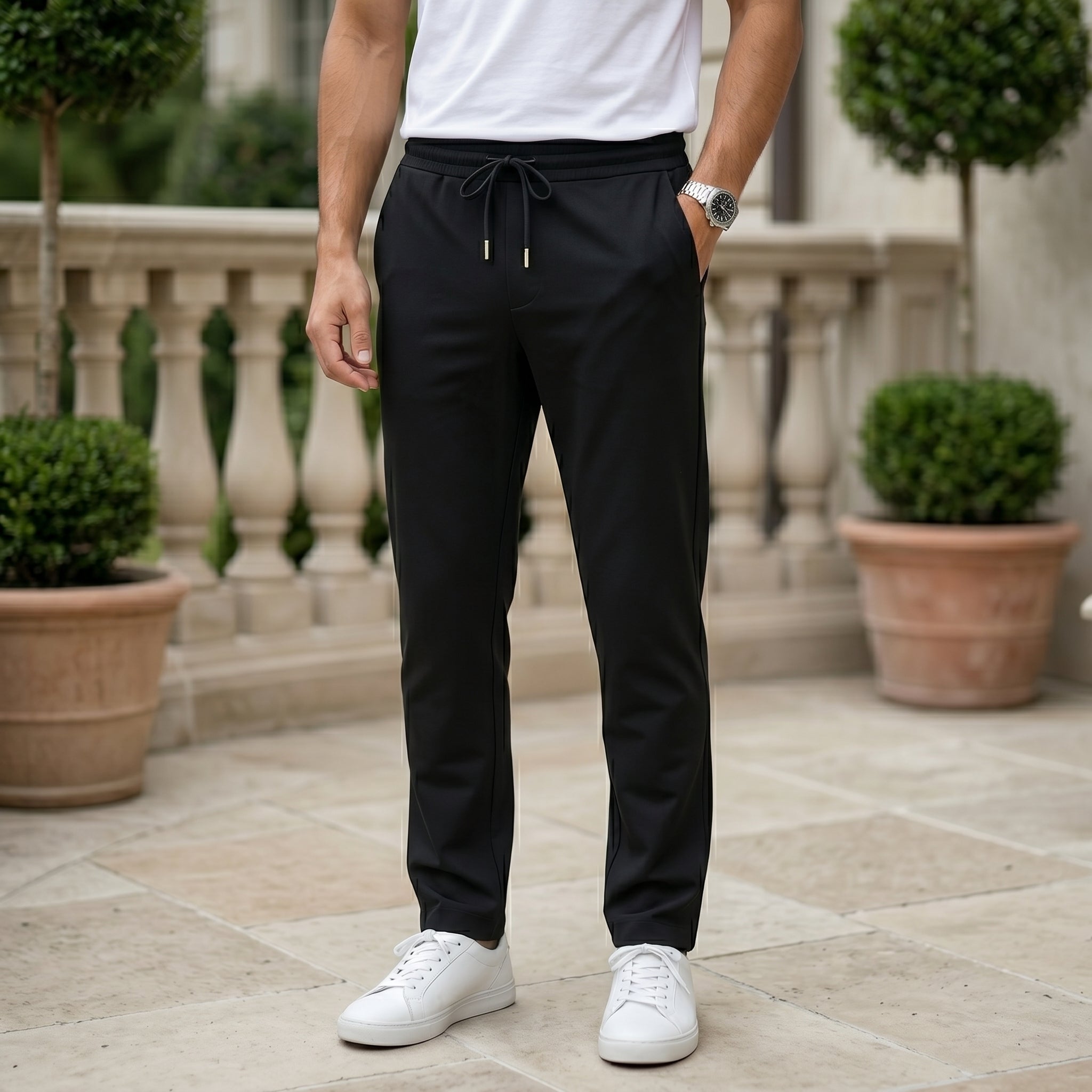 Black men’s lightweight drawstring pants with elastic waistband and clean casual fit
