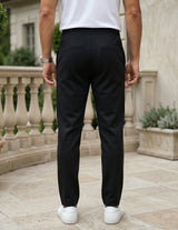 Black men’s lightweight drawstring pants with elastic waistband and clean casual fit back view