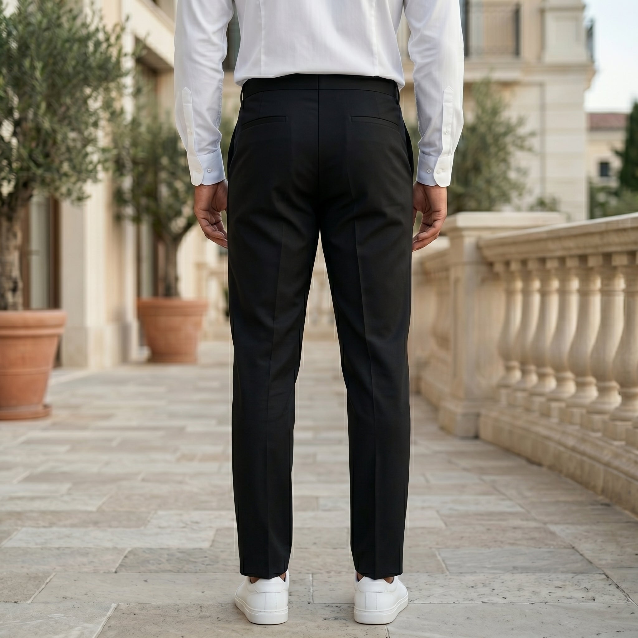 Black men’s pleated tailored pants with clean front closure and straight fit back view