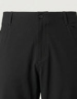 Black men’s stretch pocketed pants with clean straight fit and button-front closure close-up details