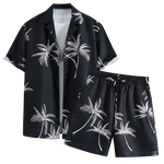 Black palm print short-sleeve shirt with matching drawstring shorts on a white background.