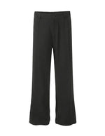 Black pants on a light gray background
