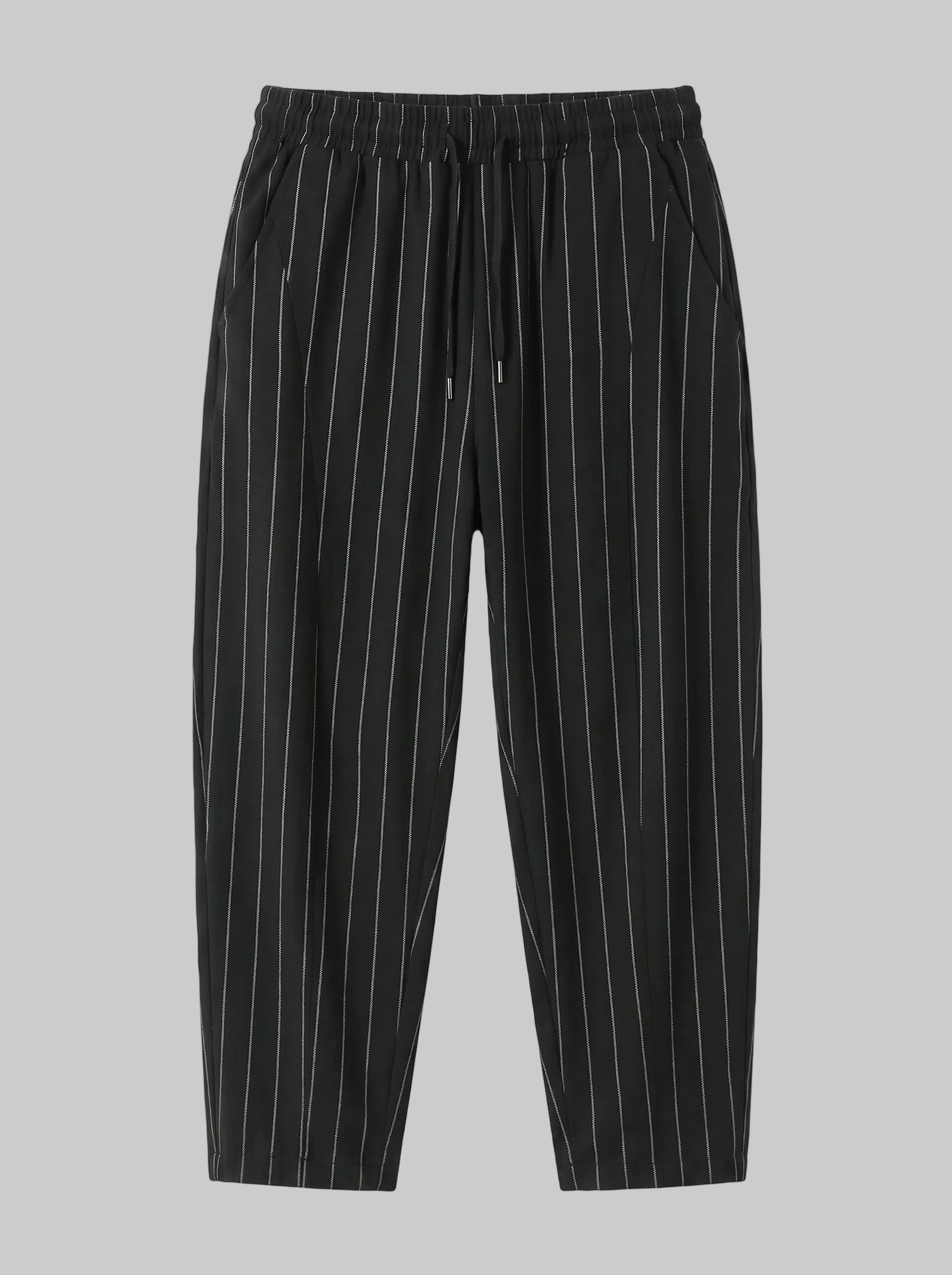 Black pinstripe trousers with thin white vertical stripes, featuring an elastic waistband and drawstring, shown against a plain white background.