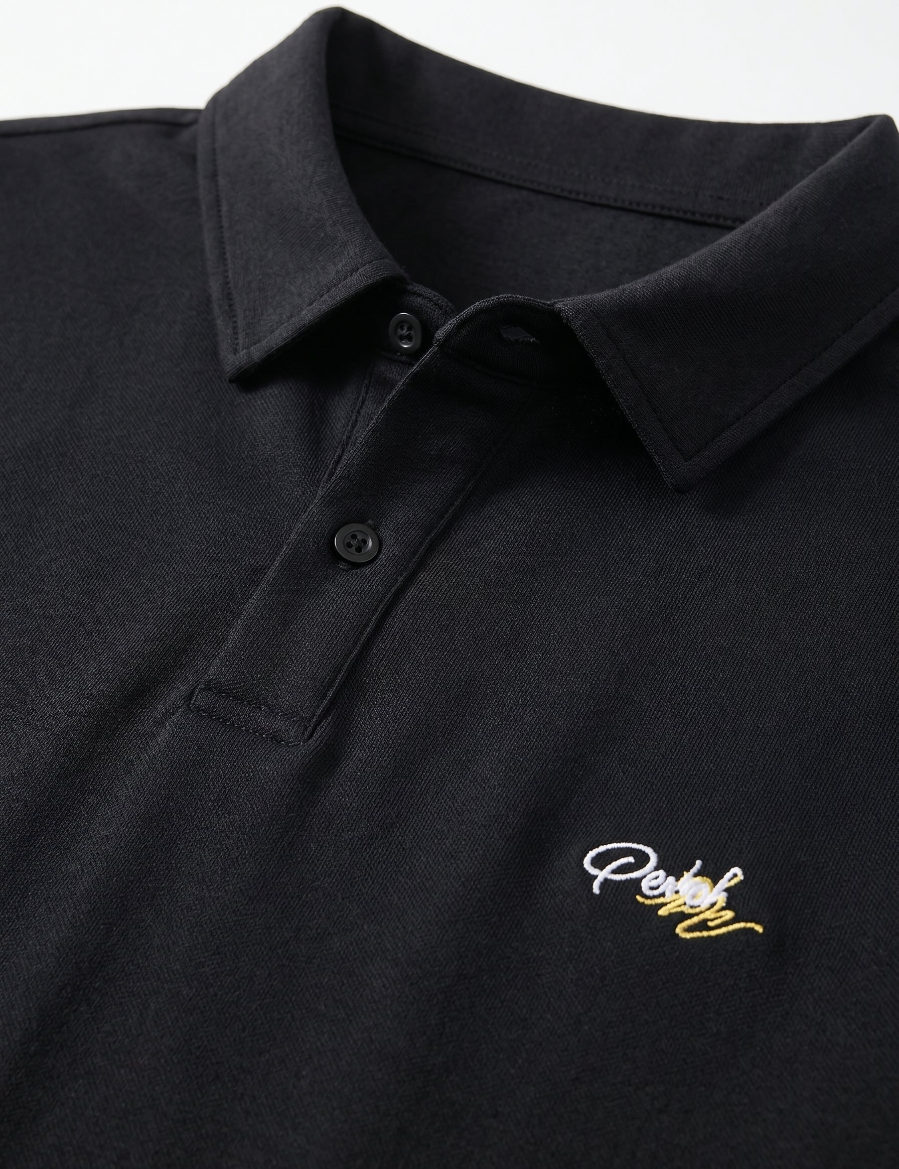 Black polo shirt with a small embroidered logo on the chest.