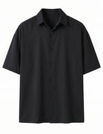 Black short-sleeve button-up shirt on a white background