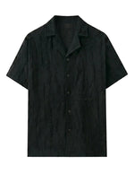 Black short-sleeve shirt on a light gray background