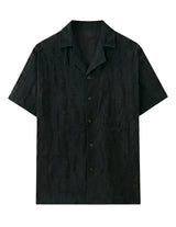 Black short-sleeve shirt on a light gray background