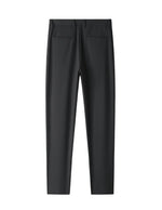 Black tailored casual pants with straight legs on a white background.
