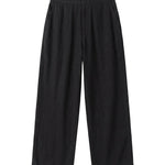Black textured relaxed-fit pants with straight legs on a white background.