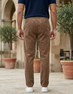Brown men’s ribbed drawstring pants with elastic waistband and side pockets back view