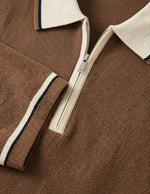 Brown sweater with a zipper and white collar