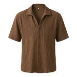 Brown textured short-sleeve collared shirt on a white background.