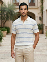 Celeste - Man wearing a striped polo shirt and beige pants standing in an outdoor setting with buildings and plants.