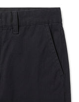 Close-up detail of black casual pants waistband, button closure, and soft fabric.