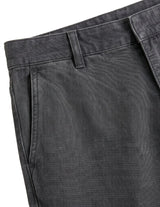 Close-up detail of charcoal gray casual pants waistband, side pocket, and textured fabric.