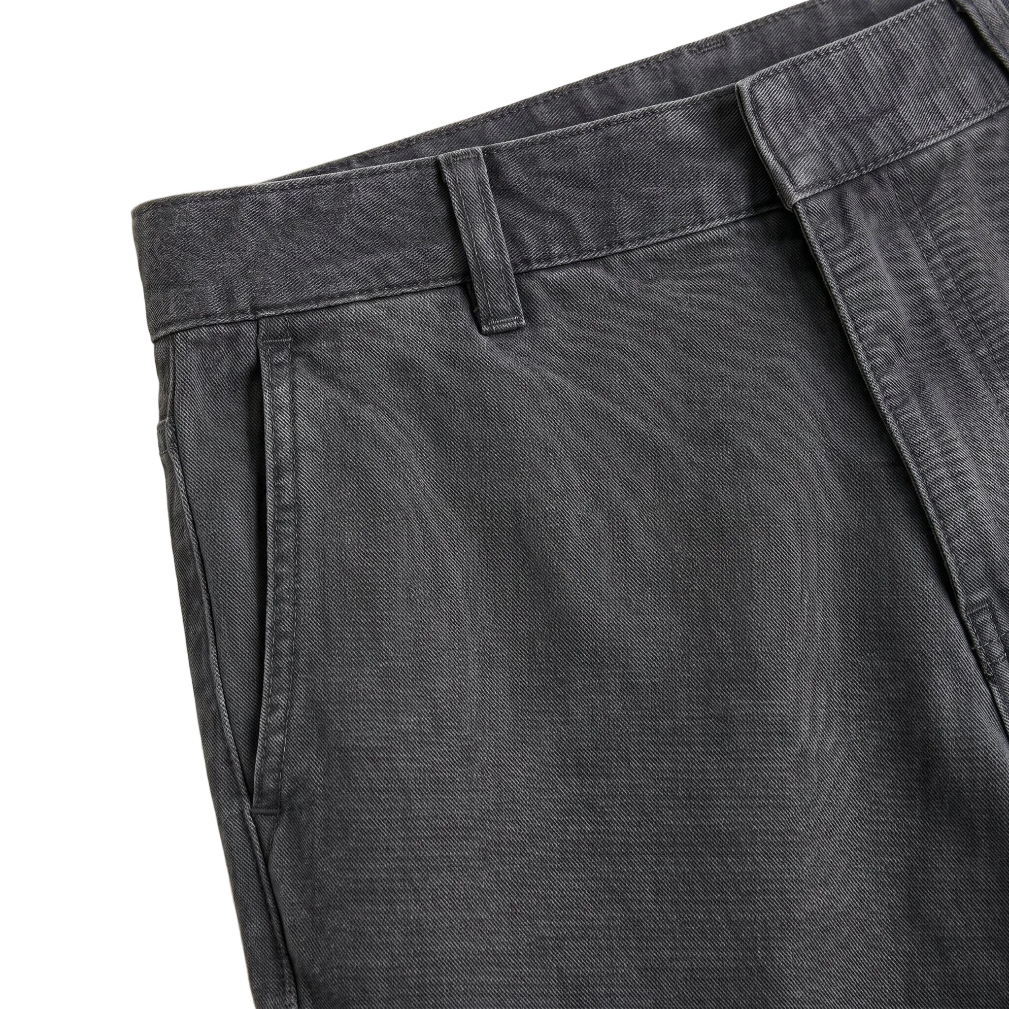 Close-up detail of charcoal gray casual pants waistband, side pocket, and textured fabric.