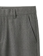 Close-up detail of gray tailored pants waistband, side pocket, and smooth fabric.