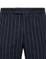 Close-up detail of navy pinstripe pants waistband with elastic back and vertical stripe pattern.
