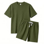 Close-up detail of olive green quilted textured fabric on the summer shorts.