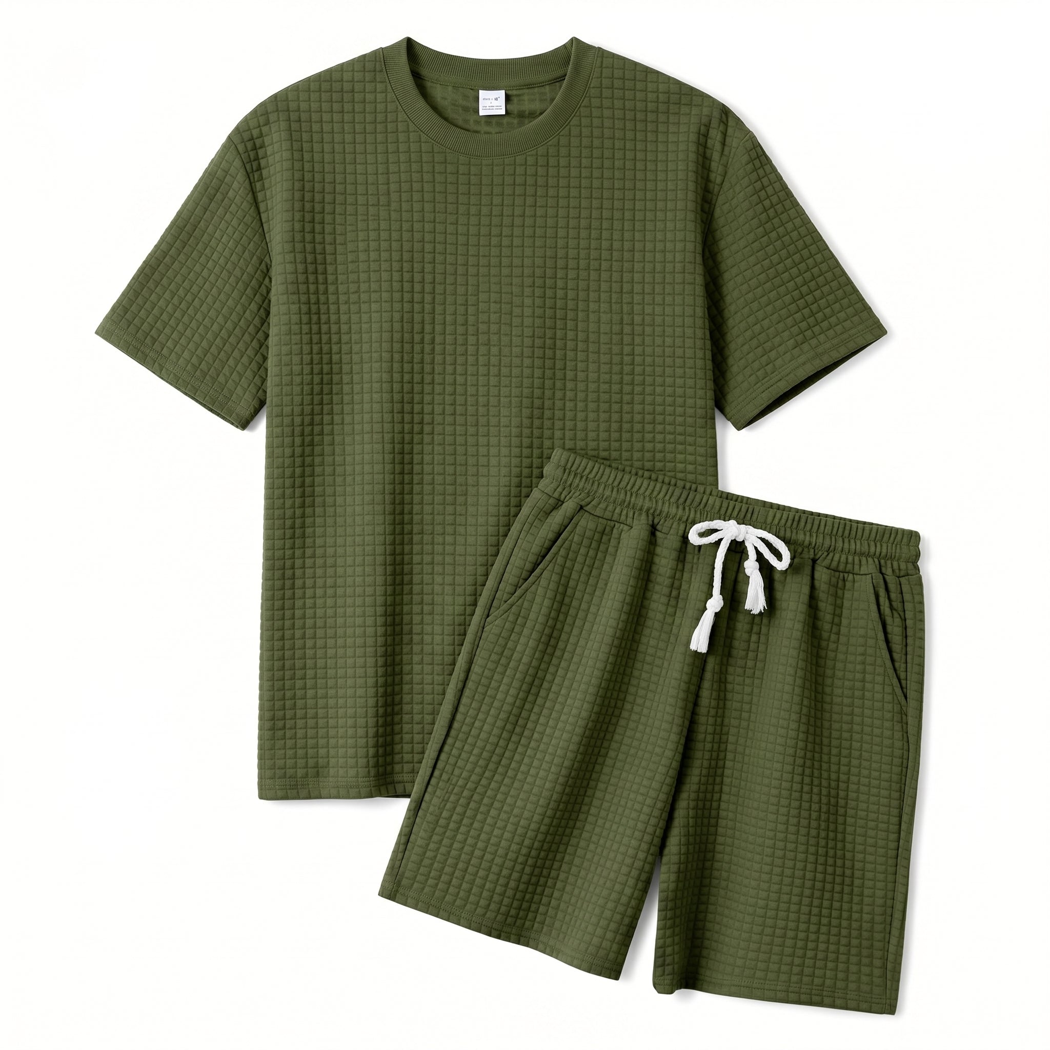 Close-up detail of olive green quilted textured fabric on the summer shorts.