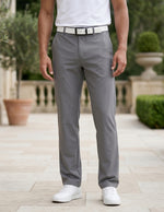 Close-up front view of male model wearing gray tailored casual pants with a straight-leg fit.