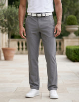 Close-up front view of male model wearing gray tailored casual pants with a straight-leg fit.