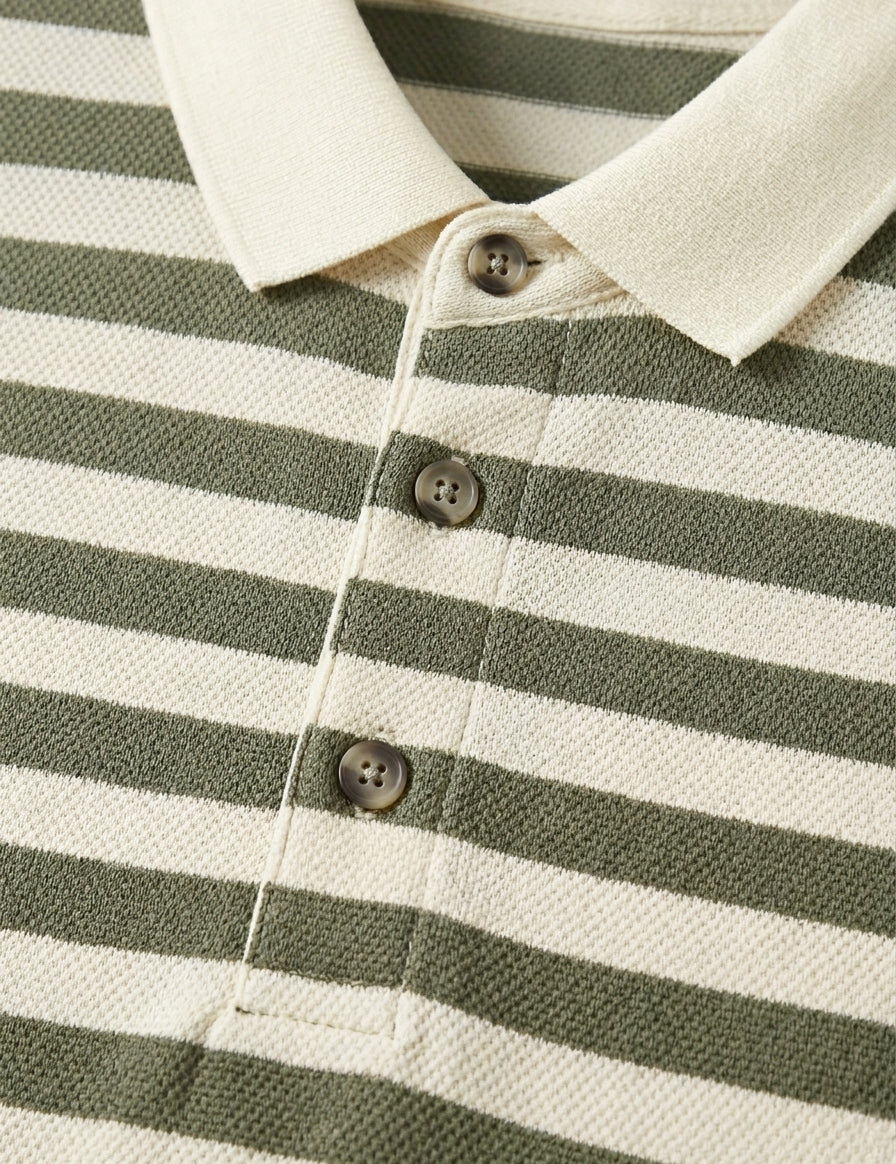 Close-up of a green and white striped shirt with buttons