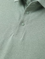 Close-up of a green polo shirt with buttons