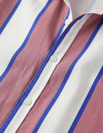 Close-up of a striped shirt with pink, white, and blue horizontal stripes.