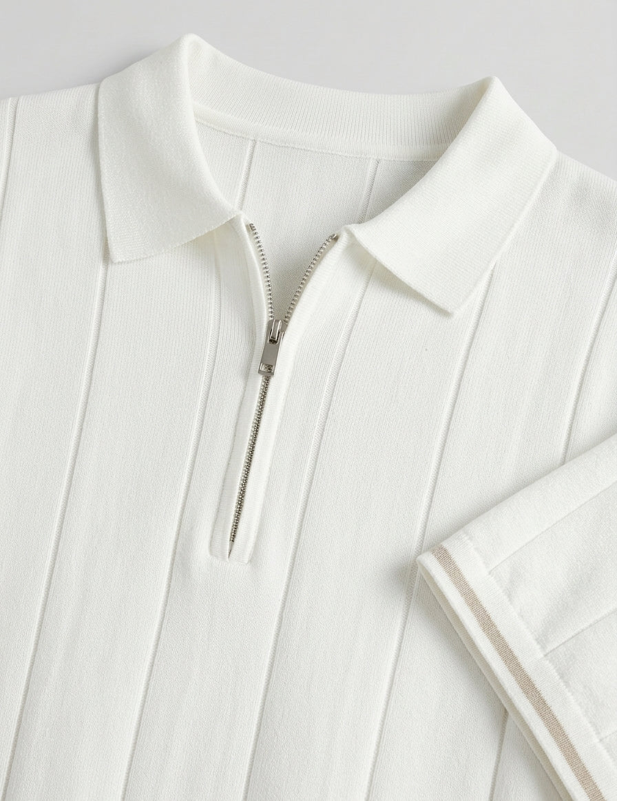 Close-up of a white jacket with a zipper on a light gray background